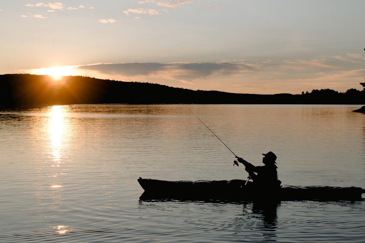 kayak fishing in sunset