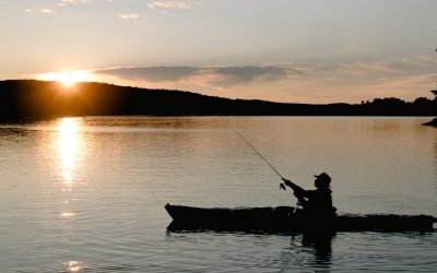 kayak fishing in sunset